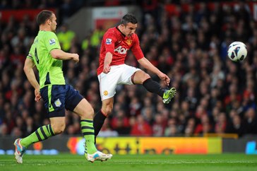 Manchester United's Robin van Persie (right) shoots to score his team's second goal  during the Barclays Premier League match at Old Trafford, Manchester. PRESS ASSOCIATION Photo. Picture date: Monday April 22, 2013. See PA Story SOCCER Man Utd. Photo credit should read: Martin Rickett/PA Wire. RESTRICTIONS: Editorial use only. Maximum 45 images during a match. No video emulation or promotion as 'live'. No use in games, competitions, merchandise, betting or single club/player services. No use with unofficial audio, video, data, fixtures or club/league logos.