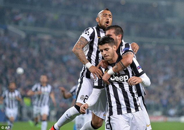 285A72E100000578-0-Alvaro_Morata_is_mobbed_by_his_team_mates_but_refuses_to_celebra-a-12_1431423230419