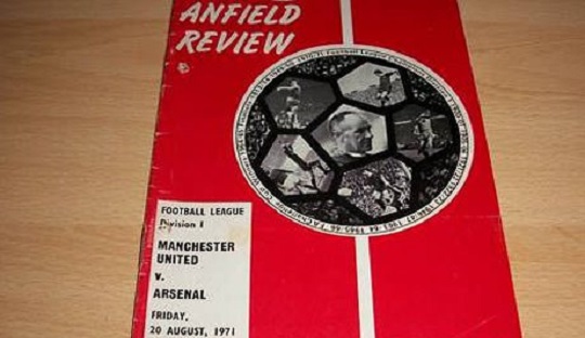 Match programme laga Manchester United vs. Arsenal. Stadion Anfield menjadi kandang sementara The Red Devils